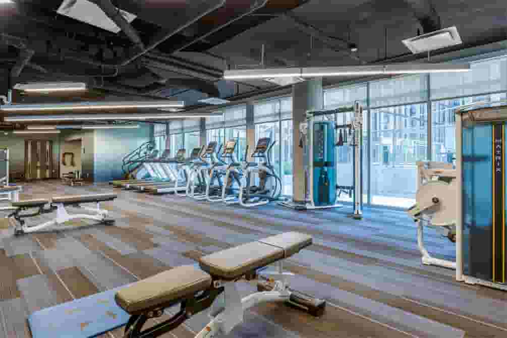 Benches and Cardio equipment in the Fitness Center with view of the Outdoor Courtyard