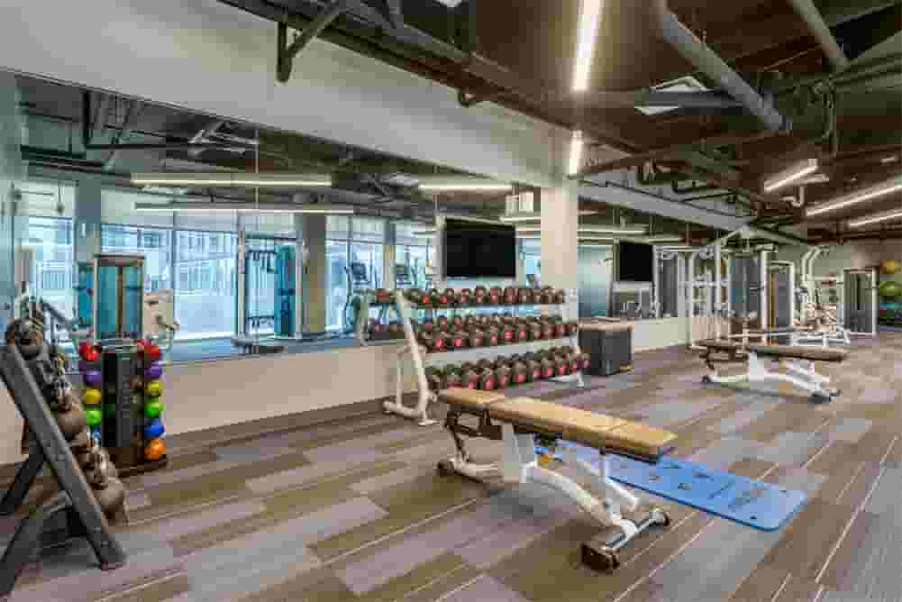 Free weights and large mirrored wall in the Fitness Center
